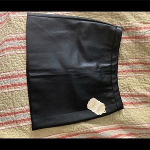 Large leather black skirt.